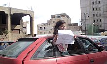 A Benghazi girl holding a paper - Σόλων ΜΚΟ